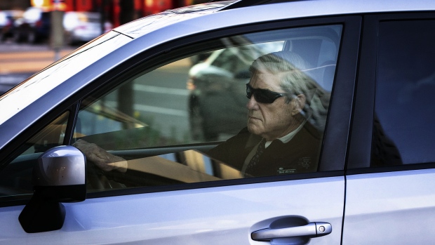 Robert Mueller arrives in a vehicle to his office in Washington on March 27. Photographer: Al Drago/Bloomberg