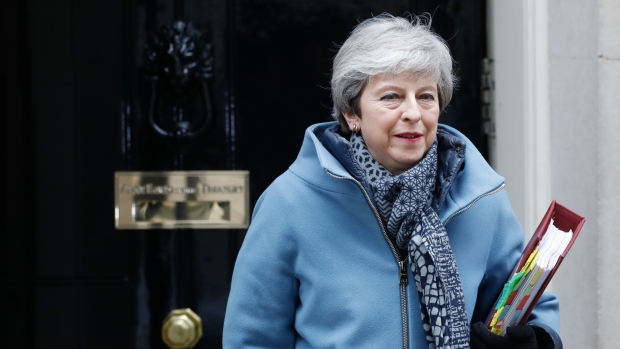 Theresa May, U.K. prime minister, departs number 10 Downing Street on her way to a weekly questions and answers session in Parliament in London, U.K., on Wednesday, March 27, 2019.  Photographer: Luke MacGregor/Bloomberg