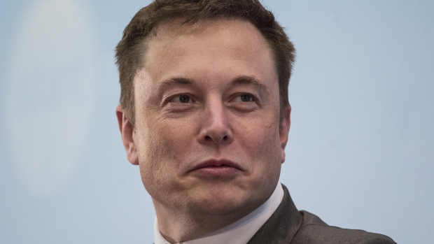 Billionaire Elon Musk, chief executive officer of Tesla Motors Inc., listens during the StartmeupHK Venture Forum in Hong Kong, China, on Tuesday, Jan. 26, 2016.