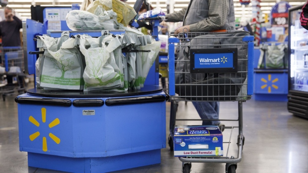 A customer purchases groceries at a Walmart Inc. store in Burbank, California, U.S., on Monday, Nov. 19, 2018. To get the jump on Black Friday selling, retailers are launching Black Friday-like promotions in the weeks prior to the event since competition and price transparency are forcing retailers to grab as much share of the consumers' wallet as they can. 