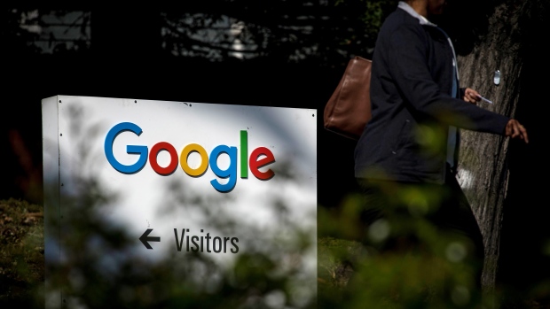 A pedestrian walks past signage at Google Inc. headquarters in Mountain View, California, U.S., on Wednesday, April 25, 2018. Alphabet Inc. is pushing efforts to roll back the most comprehensive biometric privacy law in the U.S., even as the company and its peers face heightened scrutiny after the unauthorized sharing of data at Facebook Inc. 