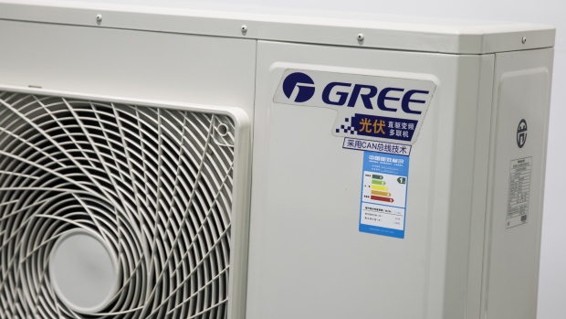 Gree Electric Appliances Ltd. is displayed on an outdoor unit of a commercial air conditioner unit at the company's showroom in Zhuhai, China, on Wednesday, March 28, 2018. Gree is China's largest air-conditioner maker. 