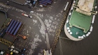 A Tesla Inc. Model 3 electric vehicle, center, travels through a port after being driven off the Morning Cindy vehicle carrier in this aerial photograph taken in Shanghai, China. 