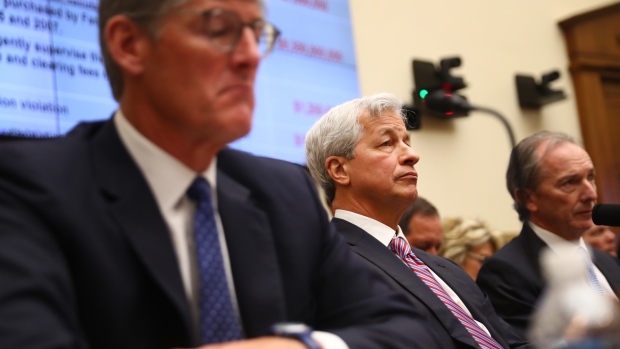 Jamie Dimon, center listens during a House Financial Services Committee hearing in Washington on April 10. 