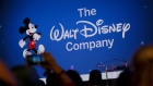 Walt Disney Co. signage is projected during the D23 Expo 2017 in Anaheim, California, U.S., on Saturday, July 15, 2017. Burbank, California-based Disney will entertain D23 guests this weekend with sneak previews of movies as well as the opportunity to purchase exclusive merchandise at dozens of shops situated in the Anaheim Convention Center. 