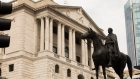A statue of the Duke of Wellington on horseback stands in front of the Bank of England (BOE) in the City of London, U.K. 