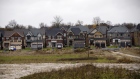 Homes stand beyond an undeveloped plot of land in East Gwillimbury, Ontario, Canada, on Friday, Nov. 2, 2018. STCA Canada is scheduled to release new housing price figures on Dec. 13. 