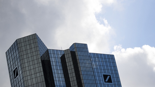 Logos sit on the Deutsche Bank AG headquarters in Frankfurt, Germany, on Monday, March 18, 2019. Rothschild & Co. and Goldman Sachs Group Inc. are advising Commerzbank AG on its merger talks with Deutsche Bank, according to people familiar with the matter. 