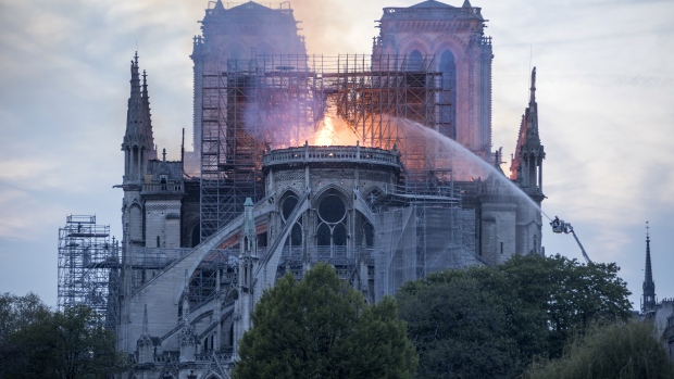 Flames and smoke rise from a fire at Notre-Dame Cathedral in Paris, France, on Monday, April 15, 201