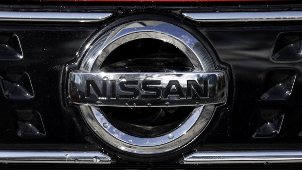 The Nissan Motor Co. badge is displayed on a vehicle outside the company's headquarters in Yokohama, Japan, on Monday, Dec. 17, 2018. Renault SA is pushing Nissan to call a shareholder meeting as soon as possible to discuss the Japanese automaker’s indictment, governance and the French company’s appointees on Nissan’s board, people familiar with the matter said. 