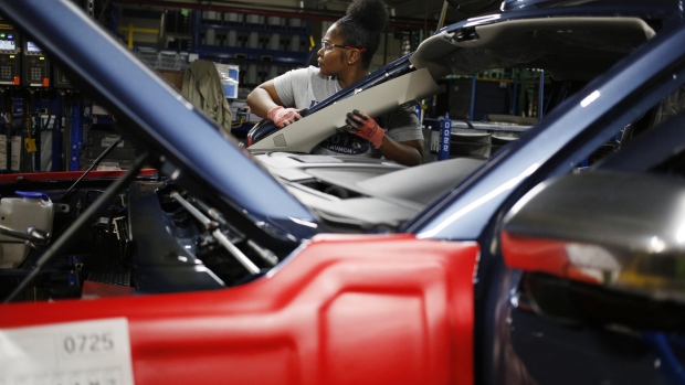 An employee works on a Ford Expedition on the Kentucky plant assembly line in Louisville. 
