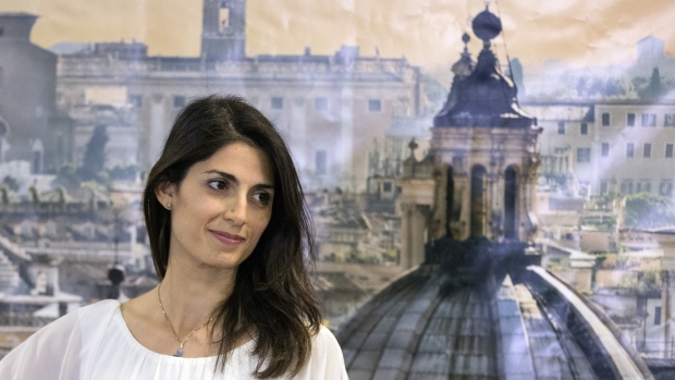 Virginia Raggi, Rome's mayor-elect, smiles during a news conference in Rome, Italy, on Monday, June 20, 2016. Italy's anti-establishment Five Star Movement is poised to win elections in Rome and Turin in a populist surge that would give the Italian capital its first female mayor and threaten to derail Prime Minister Matteo Renzi's reform agenda. Photographer: Alessia Pierdomenico/Bloomberg