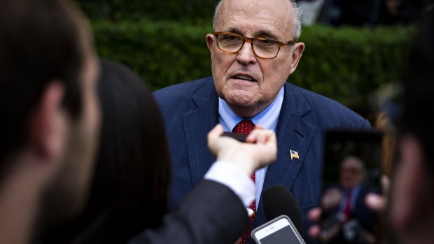 Rudy Giuliani, former mayor of New York, listens while U.S. President Donald Trump, not pictured, hosts the 2018 National Hockey League (NHL) Stanley Cup Champions, the Washington Capitals, at the Oval Office of the White House in Washington, D.C., U.S., on Monday, March 25, 2019. The Washington Capitals' Stanley Cup victory on June 7 attracted the biggest Game 5 audience for the NHL finals in 16 years, providing a boost for the NBC network. Photographer: Al Drago/Bloomberg