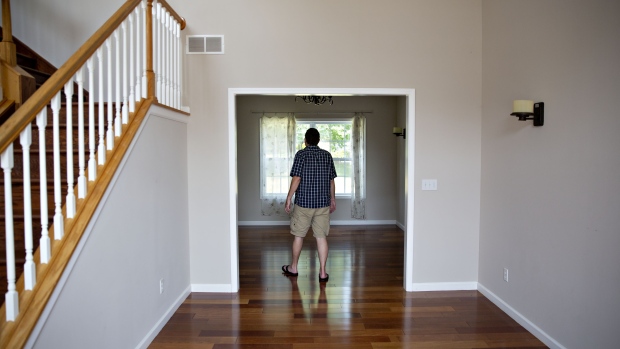 A prospective home buyer tours a house for sale in Dunlap, Illinois. 