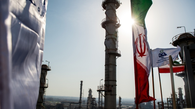 An Iranian national flag flies above the new Phase 3 facility at the Persian Gulf Star Co. (PGSPC) gas condensate refinery in Bandar Abbas, Iran. 