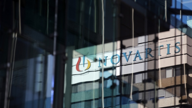 A logo sits on display on a building at the Novartis AG campus in Basel, Switzerland, on Wednesday, Jan. 16, 2019. Trying to streamline an operation that spends more than $5 billion a year on developing new drugs, Novartis dispatched teams to jetmaker Boeing Co. and Swissgrid AG, a power company, to observe how they use technology-laden crisis centers to prevent failures and blackouts. 