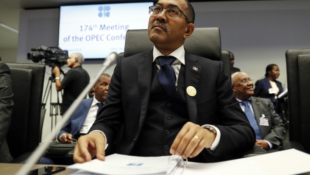 Diamantino Pedro Azevedo, Angola's petroleum minister, browses documents as he speaks to reporters ahead of the 174th Organization Of Petroleum Exporting Countries (OPEC) meeting in Vienna, Austria, on Friday, June 22, 2018. OPEC and its allies reached a preliminary agreement in the face of strong opposition from Iran to boost production by a theoretical 1 million barrels a day - the actual increase will be smaller as several countries are unable to raise output. Photographer: Stefan Wermuth/Bloomberg