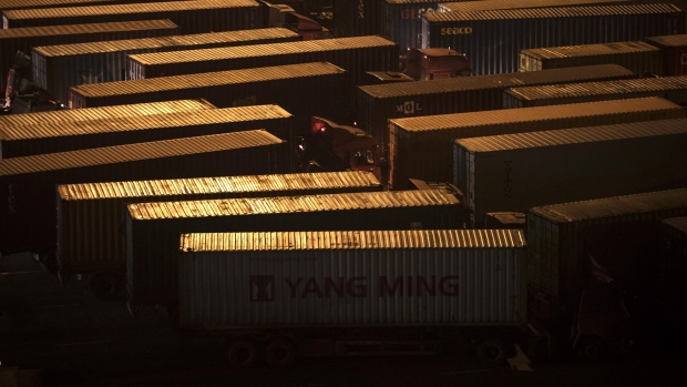 Trucks sit parked at the Yangshan Deepwater Port, operated by Shanghai International Port Group Co. (SIPG), at night in Shanghai, China on Wednesday, Jan. 30, 2019. The U.S. and China launched high-level trade talks in Washington with little indication that Beijing will bend to U.S. demands to deepen economic reforms. 