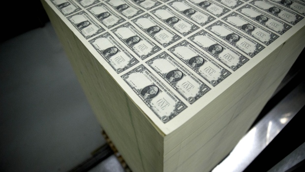 50 subject one dollar note sheets sit in a stack before receiving a serial number and the U.S. Treasury and U.S. Federal Reserve seals at the U.S. Bureau of Engraving and Printing in Washington, D.C., U.S. Photographer: Andrew Harrer