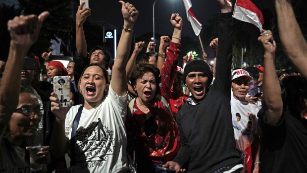 Supporters of Joko Widodo, Indonesia's president, celebrate on the streets in Jakarta, Indonesia, on Wednesday, April 17, 2019.
