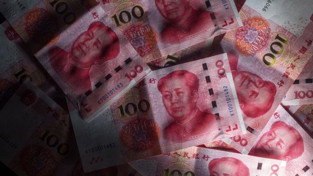 Chinese one-hundred yuan banknotes are arranged for a photograph in Hong Kong, China, on Monday, April 15, 2019. China's holdings of Treasury securities rose for a third month as the Asian nation took on more U.S. government debt amid the trade war between the world’s two biggest economies. 