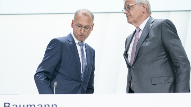 Werner Baumann, left, stands with Werner Wenning, prior to the company's AGM in Bonn, on April 26. 