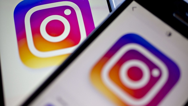 Facebook Inc.'s Instagram logo is displayed on the Instagram application on an Apple Inc. iPhone in this arranged photograph taken in Washington, D.C., U.S. 