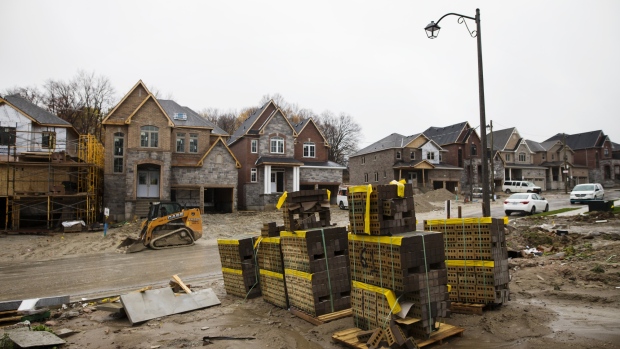 Stacks of bricks sit in front of homes under construction in East Gwillimbury, Ontario, Canada, on Friday, Nov. 2, 2018. STCA Canada is scheduled to release new housing price figures on Dec. 13. 