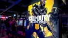 Attendees play the Activision Blizzard Inc. Call Of Duty: Black Ops 4 video game at the company's booth during the E3 Electronic Entertainment Expo in Los Angeles, California, U.S., on Tuesday, June 12, 2018. For three days, leading-edge companies, groundbreaking new technologies and never-before-seen products is showcased at E3. 