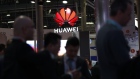 An illuminated logo hangs above the Huawei Technologies Co. pavilion on the opening day of the MWC Barcelona in Barcelona, on Feb. 25. 