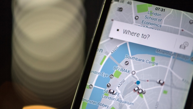 A London street map sits on a smartphone using the Uber Technologies Inc. ride-hailing service smartphone app in this arranged photograph in London, U.K., on Friday, Dec. 22, 2017. Uber will be regulated in European Union countries as a transport company after the bloc's top court rejected its claim to be a digital service provider, a decision that could increase legal risks for other gig-economy companies including Airbnb. 