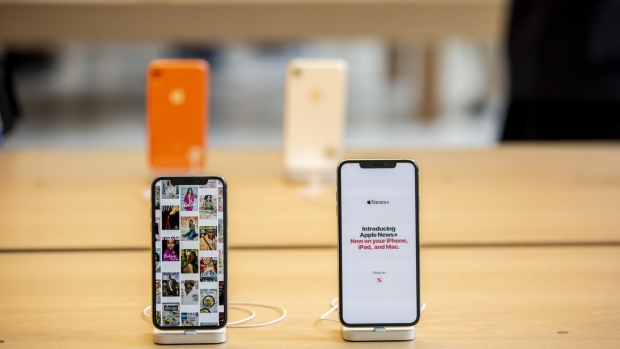 Apple Inc. iPhone smartphones sit on display during the opening of the company's new Carnegie Library store at Mount Vernon Square in Washington, D.C., U.S on Saturday, May 11, 2019. 