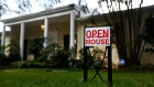 An "Open House" sign is displayed outside of a home for sale in Miami, Florida, U.S. 