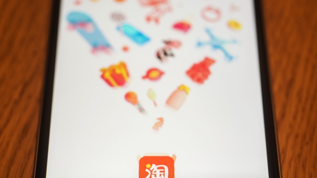 The loading page for Alibaba Group Holding Ltd.'s Taobao application is displayed on an Apple Inc. iPhone in an arranged photograph taken in Hong Kong, China, on Wednesday, July 26, 2017.