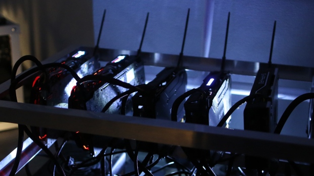 A cryptocurrency mining rig composed of Asus Strix machines operates at the SberBit mining \'hotel\' in Moscow, Russia, on Saturday, Dec. 9, 2017. FuturesÂ on the worldâs most popular cryptocurrency surged as much as 26 percent in their debut session on Cboe Global Markets Inc.\'s exchange, triggering two temporary trading halts designed to calm the market.Â 