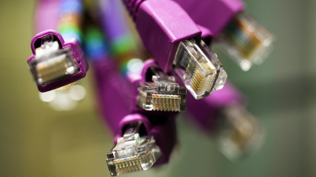 Terminals of data cables sit inside a comms room at an office in London, U.K., on Friday, Oct. 16, 2015. A group of Russian hackers infiltrated the servers of Dow Jones & Co., owner of the Wall Street Journal and several other news publications, and stole information to trade on before it became public, according to four people familiar with the matter. 