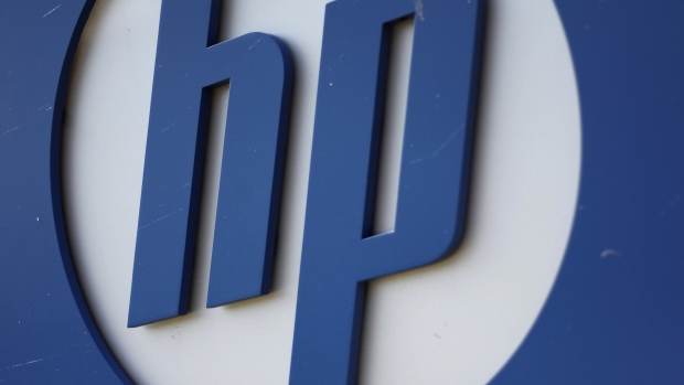 The Hewlett-Packard Co. logo is displayed outside the company's HP Enterprise Services unit in Plano, Texas, U.S., on Wednesday, May 23, 2012. Hewlett-Packard, the world's largest PC maker, will cut 27,000 jobs, or about 8 percent of its staff. Many of the cuts will come from the ailing enterprise services group, which manages data centers and provides technology consulting. 