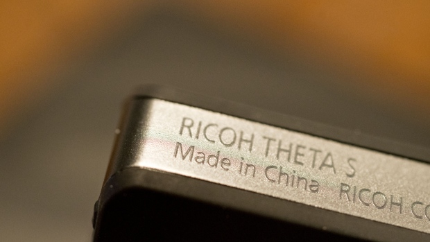 The words "Made In China" are seen on an Ricoh Co. Theta S camera displayed for a photograph in Tiskilwa, Illinois, U.S., on Tuesday, April 10, 2018. A week after escalating tensions with his threat to impose tariffs on an additional $100 billion in Chinese products, President Trump said Thursday the two countries ultimately may end up levying no new tariffs on each other. 