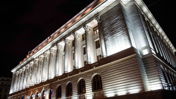 Lights shine on the exterior of the Romanian central bank, the Banca Nationala A Romaniei, as the building is illuminated at night in Bucharest, Romania, on Thursday, June 11, 2015. Battling to retain his three-year premiership, Romania's Prime Minister Victor Ponta denies allegations including money laundering and complicity in tax fraud, leveled in the first Romanian criminal probe to target a sitting head of government. 
