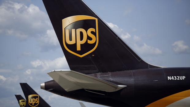 Cargo jets sit parked on the tarmac while being unloaded during the afternoon sort at the United Parcel Service Inc. (UPS) Worldport facility in Louisville, Kentucky, U.S. 