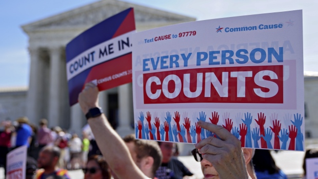 A demonstrator holds an "Every Person Counts" sign outside the U.S. Supreme Court during oral arguments in the Department of Commerce v. New York, 18-966, case in Washington, D.C., U.S., on Tuesday, April 23, 2019. Key Supreme Court justices seemed inclined to let the Trump administration add a question about citizenship to the 2020 census in a clash that will shape the allocation of congressional seats and federal dollars. 