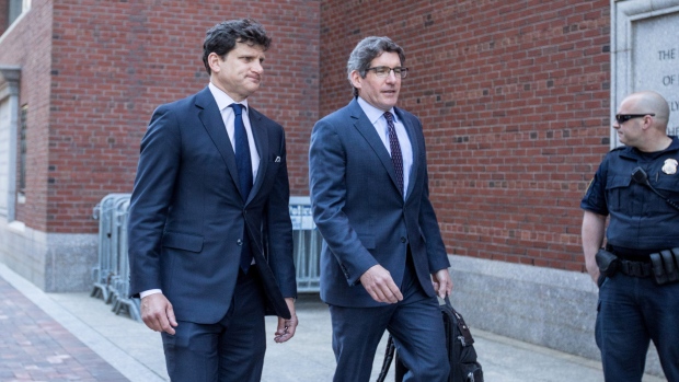 Gordon Caplan, left, arrives at federal court in Boston on May 21, 2019. 