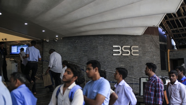 People stand in line at the Bombay Stock Exchange (BSE) building in Mumbai, India, on Tuesday, Dec. 11, 2018. India’s new central bank governor has a list of challenges to face as he takes office: from fixing a banking crisis to convincing investors of the institution’s autonomy. 