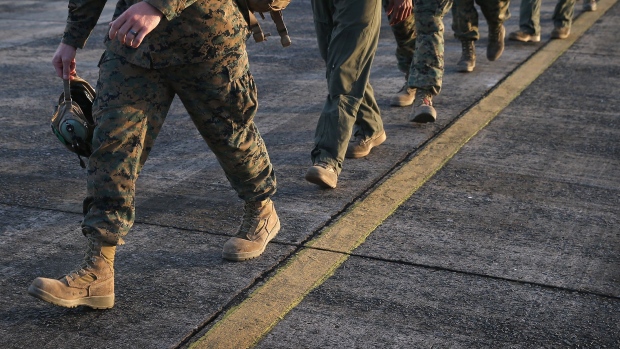 MONROVIA, LIBERIA - OCTOBER 09: U.S. Marines arrive as part of Operation United Assistance on October 9, 2014 in Monrovia, Liberia. Some 90 Marines, the largest group of U.S. military yet, arrived on KC-130 transport planes and MV-22 Ospreys to support the American effort to contain the Ebola epidemic. The four Ospreys, which can land vertically like helicopters, will transport U.S. troops and supplies as they build 17 Ebola treatment centers around Liberia. U.S. President Barack Obama has committed up to 4,000 troops in West Africa to combat the disease. (Photo by John Moore/Getty Images) 