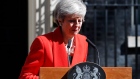British Prime Minister Theresa May reacts after making a speech in the street outside 10 Downing. 
