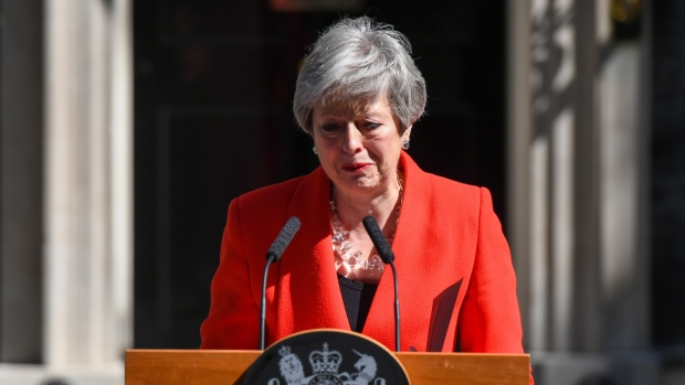 Theresa May, U.K. prime minister, reacts as she delivers a speech announcing her resignation outside number 10 Downing Street in London, U.K., on Friday, May 24, 2019. May said she will step down on June 7. Photographer: Chris J. Ratcliffe/Bloomberg
    