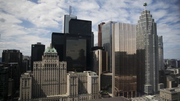 (TD) building, right, stands in the financial district of Toronto, Ontario, Canada, on Wednesday, Ju