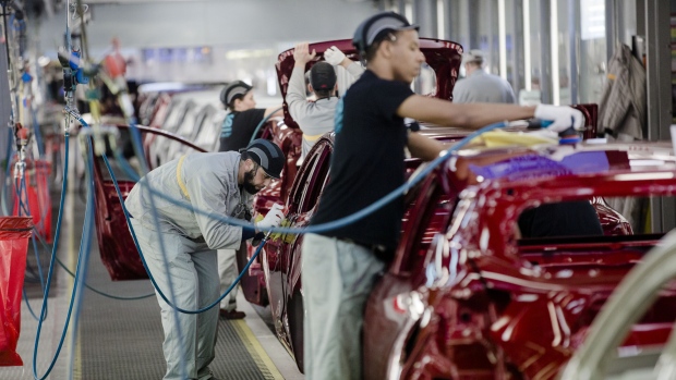 Employee carry out final inspections on the body shells of freshly painted Nissan Micra, right, and Renault Clio, second left, automobiles inside the Renault SA factory in Flins, France, on Thursday, Feb. 23, 2017. Carlos Ghosn, one of the auto industry's most celebrated turnaround artists, is relinquishing his CEO role at Nissan Motor Co. and turning over day-to-day control to Hiroto Saikawa as he focuses on strengthening the carmaker's alliance with Renault and Mitsubishi Motors Corp. 