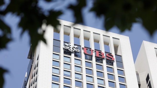 The UBS Group AG logo sits on the bank's skyscraper offices in Frankfurt, Germany, on Tuesday, July 17, 2018. Frankfurt's efforts to attract bankers escaping Brexit are in danger of losing momentum. 
