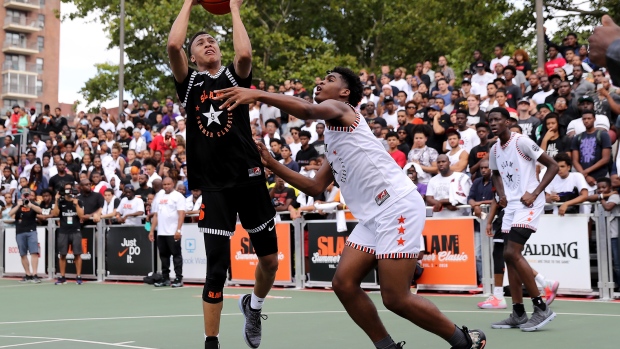 NEW YORK, NY - AUGUST 18: RJ Hampton #5 of Team Ramsey heads for the net as Josh Christopher #3 of Team Stanley defends during the SLAM Summer Classic 2018 at Dyckman Park on August 18, 2018 in New York City. (Photo by Elsa/Getty Images)